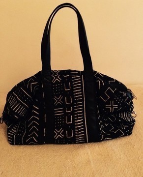 Leather travel bag and bogolan.