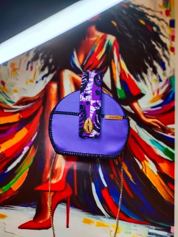 Unique chic outing bag in leather and wax print fabric