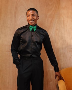 A Silk, charcoal black pleated tuxedo shirt.