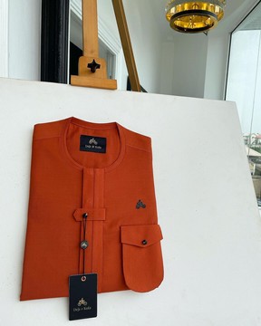 A fire orange, double vertical Flap with horizontal closed detailing Kaftan