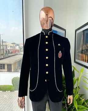 A  black Soaked Italian velvet, long sleeve with woven white tread taping safari suit