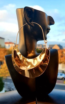 Large gold colored earrings