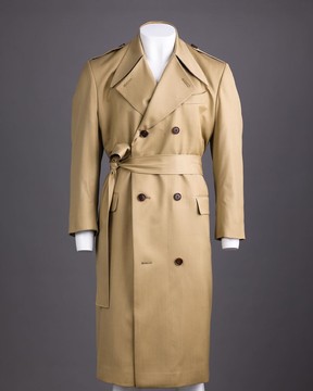 A cream double-breasted coat.