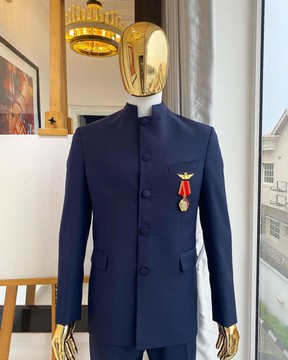 A midnight blue “French” safari suit and matching pant trousers