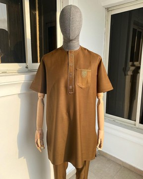An coffee brown &amp; traditional embroidery senator kaftan.