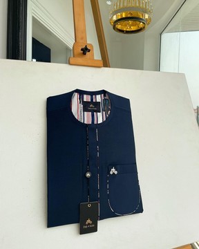 A Navy blue, sport paisley detailing flap and patch pocket &amp; dotted front flap kaftan native.