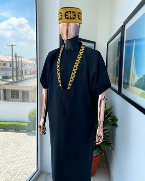 A charcoal black dagbtan, connected star gold embroidery detailing senator native.