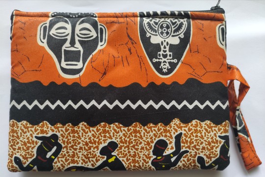 Mini wax pouch with African mask patterns