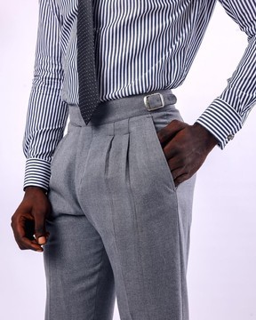 A light grey, double pleat with side metal adjuster Gurkha pant
