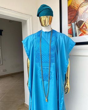 A deep sky blue agbada, hand knitted aso oke cap, kaftan &amp; sokoto