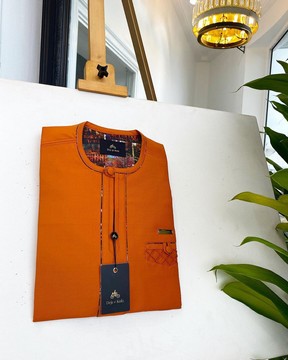 A Fire Orange, covered button, paisley design senator kaftan native.