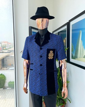 A notch lapel, sky and splash of navy blue floral jacquard short sleeve safari suit