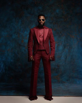 A burgundy monochrome, knitted, hand-woven aso-oke, matching bead layering tuxedo suit