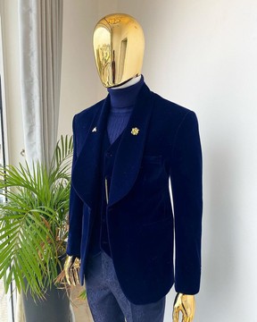 Un costume de smoking en velours imbibé de revers châle bleu nuit