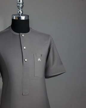 A grey front flap with Swarovski crystal button shirt sleeve African kaftan