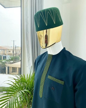 An Emerald Green Kaftan with a dispersed dotted embroidery design.