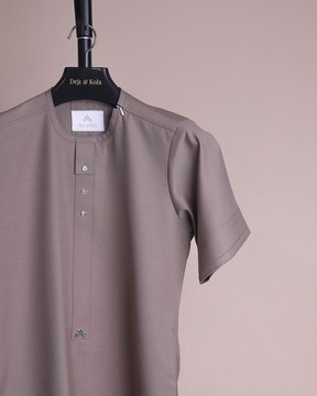 A fossil grey, return front flap with clear view Swarovski button details Kaftan