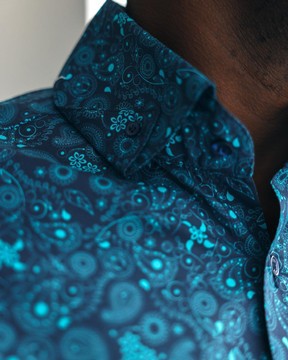 A blue, prints, high neck with turn-up collar casual shirt.