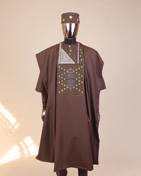 A caramel Brown, chinoiserie chic pagoda with layers metallic wire Embroidery details Agbada.