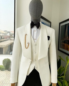 An ivory white, shawl lapel, plunged square patterned jacquard suit