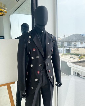 The monochrome “okorodudu” mikado satin, charcoal black, notch lapel suit