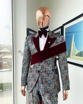 An “octopus” floral paisley tuxedo with left side strap mahogany red soaked Italian peak lapel suit