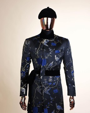A Gold, black and blue double breasted safari suit