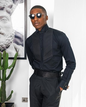 A black, wing collar, pleated evening tuxedo shirt