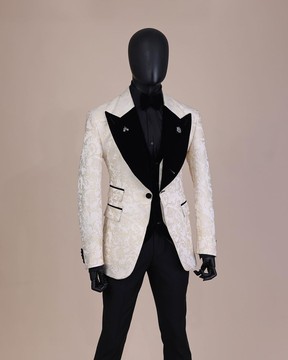 An Ivory white &amp; Gold Floral patterned Peak lapel metallic jacquard tuxedo suit &amp; layered waist coat