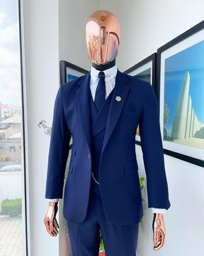 A navy blue - layered square patterned - Jorgecarli super 140’s- “Board Room” notch lapel suit