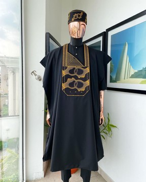 A charcoal black, connected medulla and wooven pattern embroidery detailing agbada.