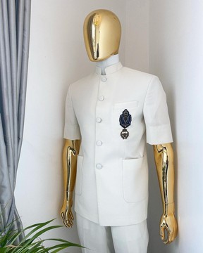 An Ivory White “French” safari suit and matching pant trousers