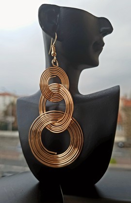 Gold-colored "swirl" earrings
