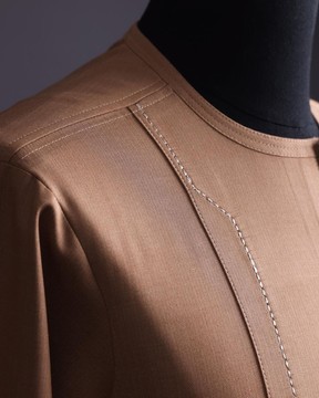 A walnut brown, rectangular front layered embroidery