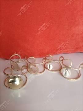 A Set of five, Brass cuffs, African cowrie shell cuff , statement bracelet