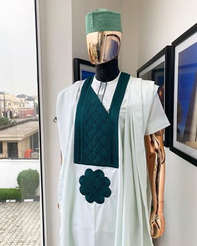 A pistachio green, connected inverted square ping green embroidery agbada