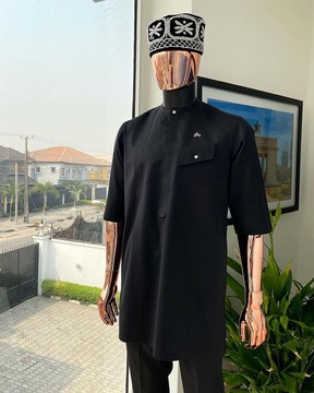A Charcoal black, slanting combat pocket, front flap with clear view swarovski button kaftan