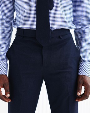 A Navy blue seer sucker, wide-cut pant with side metal adjuster.