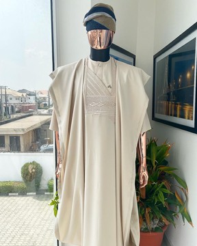 A coconut ivory, jakan design agbada, 3/4 sleeve buba laced with Swarovski stone