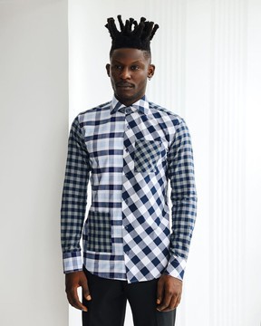 An intersected checkerboard &amp; windowpane check layered casual shirt.