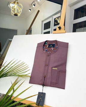 A Brown Onion Colored kaftan with brown coconut shell button detailing.