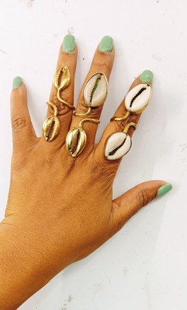 Double cowrie rings, wholesale rings, adjustable rings, brass rings, African rings.