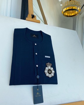 A midnight blue, African traditional senator kaftan native.