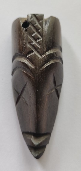 ebony wood fridge magnet carved in the shape of an African mask - fridge magnet