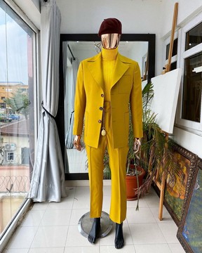 The reloaded “ Festac 77” mustard yellow 3 button safari suit