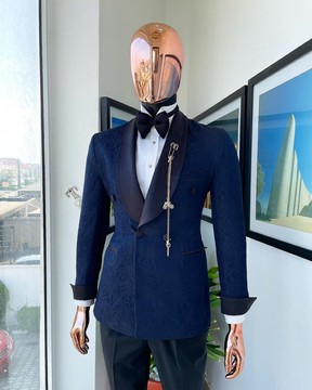 Un costume de smoking bleu marine à motif floral, revers châle, boutonnage simple et double boutonnage