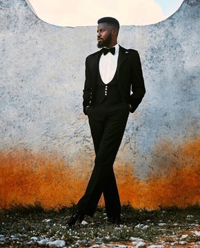 A layered combat charcoal black tuxedo suit, u-shaped waist coat
