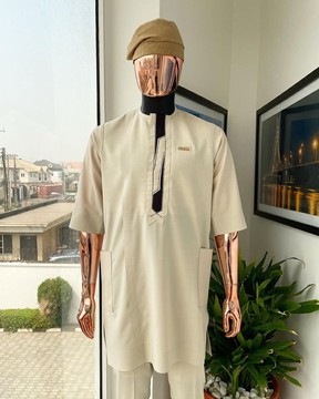 An almond cream, lane, intersection flap, side patch pocket detailing african kaftan
