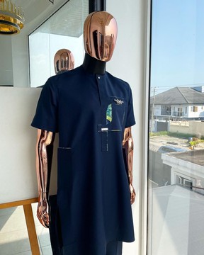 A Navy blue, multileg intersection pocket with clear view flap Swarovski button detailing Kaftan