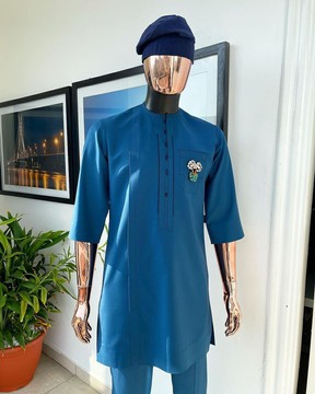 A sapphire blue, front flap, embroidery square rectangle flap and pocket design kaftan
